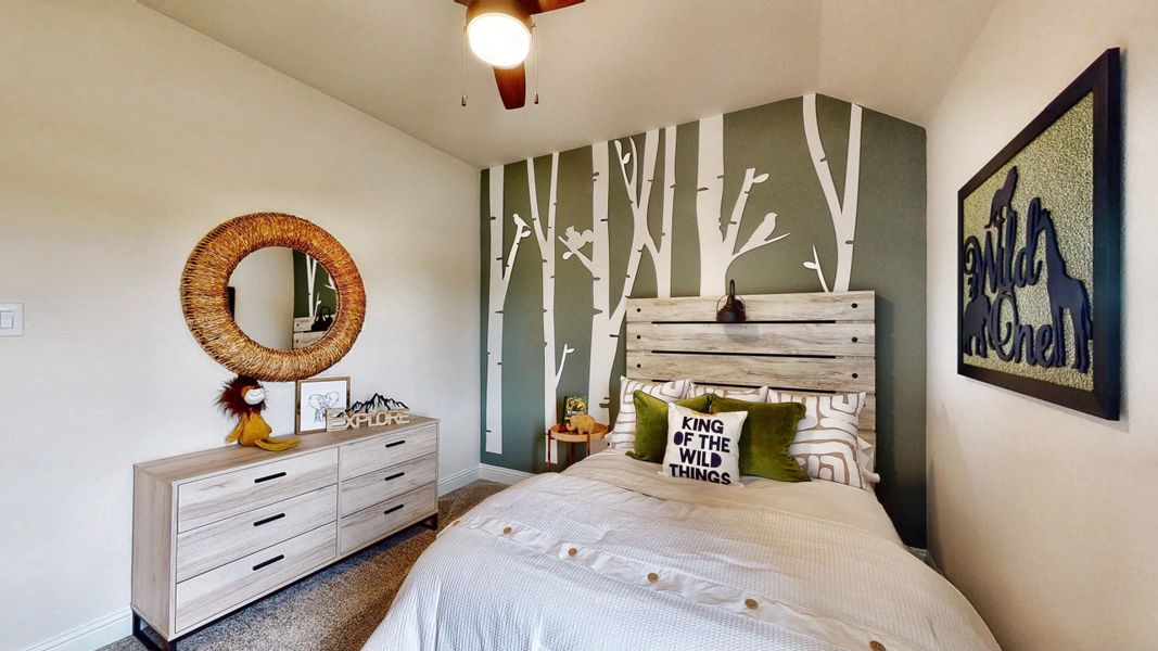 A bedroom with a bed and dresser. A bedroom with a bed and dresser.