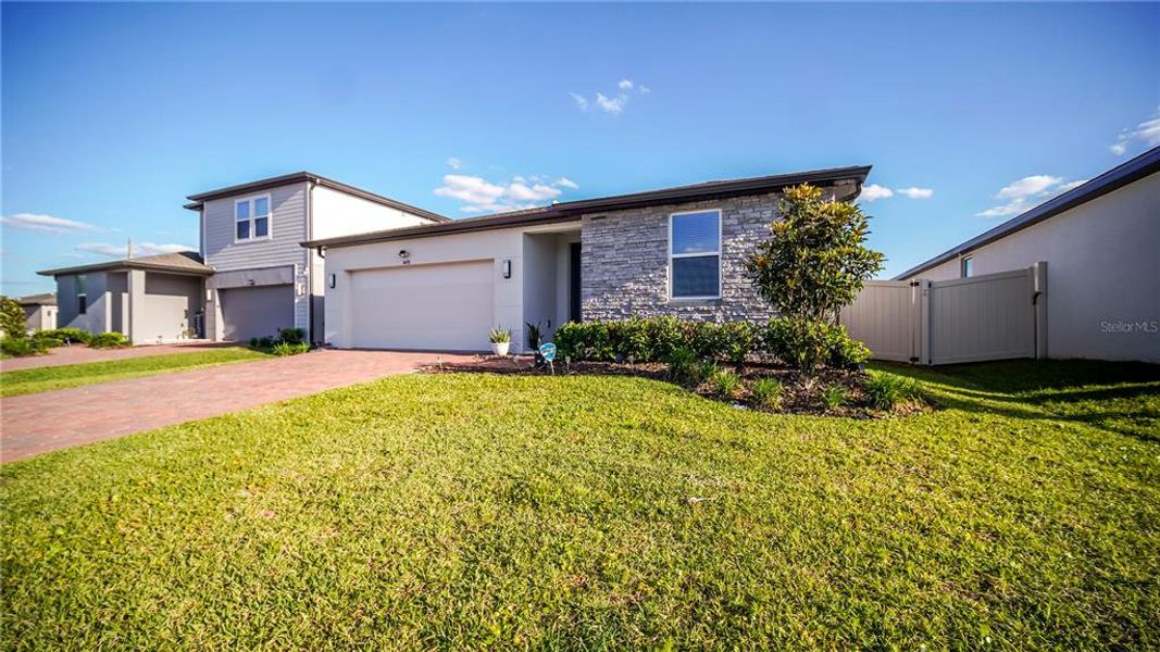 Front exterior of a new home in , St. Cloud, FL, highlighting curb appeal (Image 22).