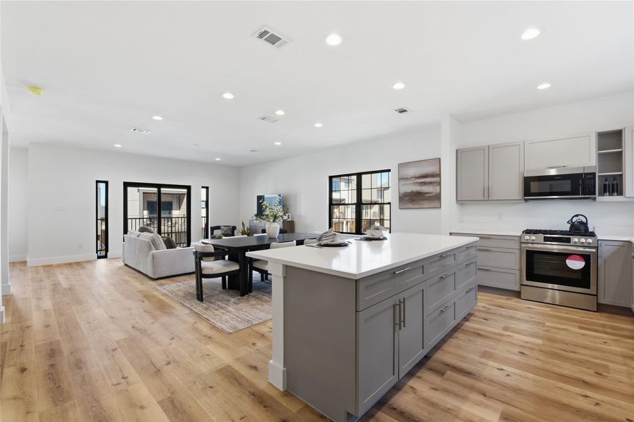 Open-concept living space with hardwood floors.