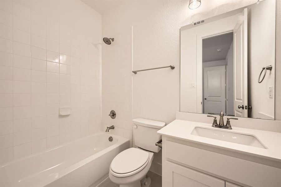 Bathroom featuring vanity and tub / shower combination