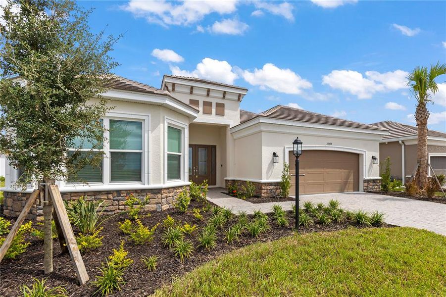 Front exterior of a new home in , Sarasota, FL, highlighting curb appeal (Image 23).