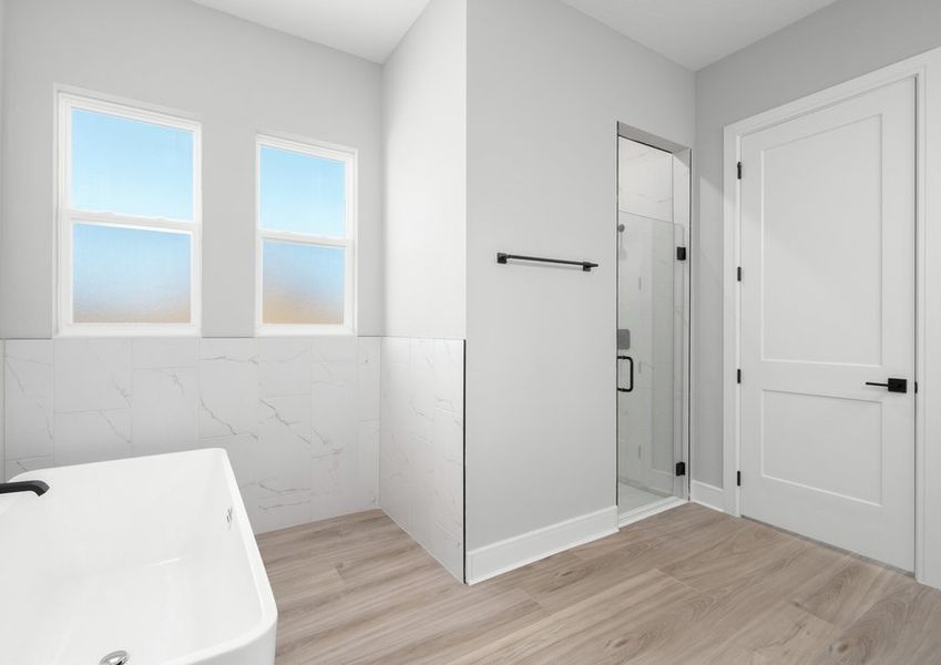 The master bathroom is spacious and peaceful.