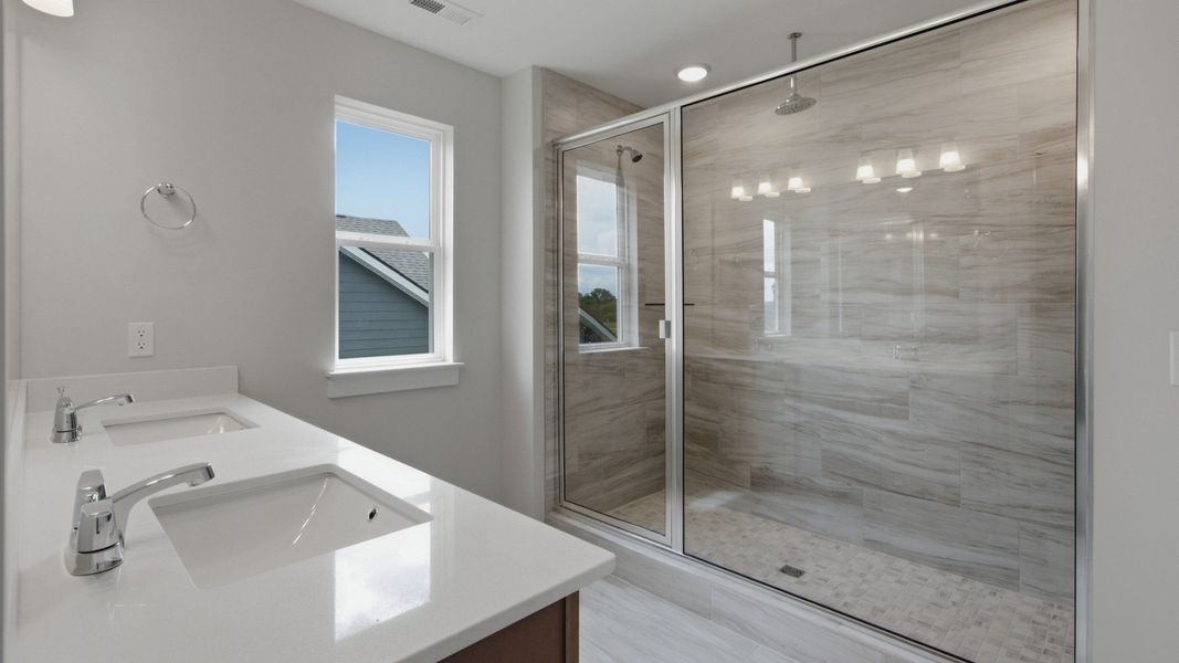 Elevated roman-shower across dual vanities Elevated roman-shower across dual vanities