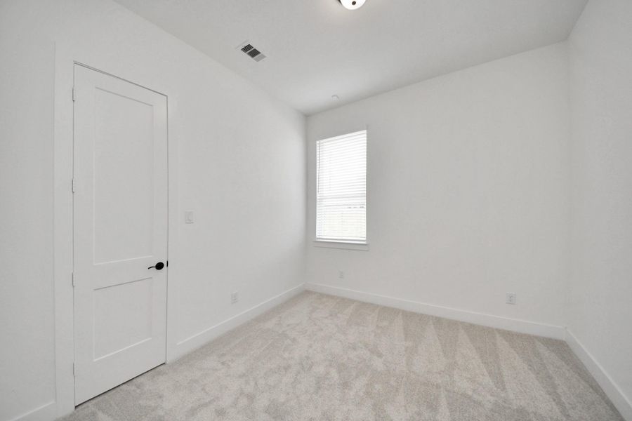 Spacious, unfurnished interior of a new home in Meridiana Courtyard Collection, Manvel (Image 29).