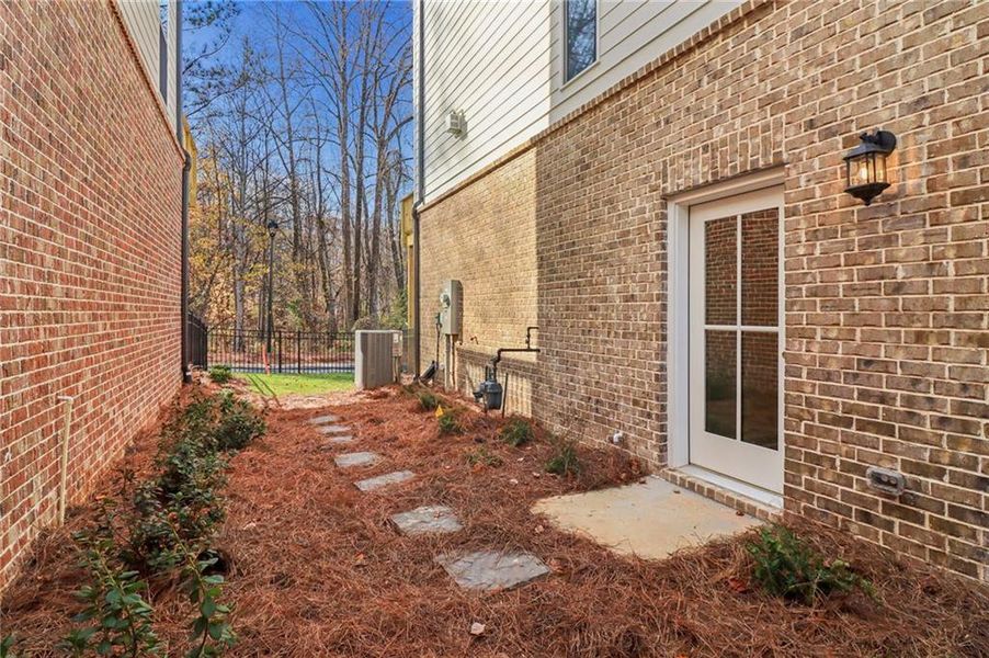Exterior details and patio area of a home in Brackley Single Family, Cumming (Image 40). Exterior details and patio area of a home in Brackley Single Family, Cumming (Image 40).