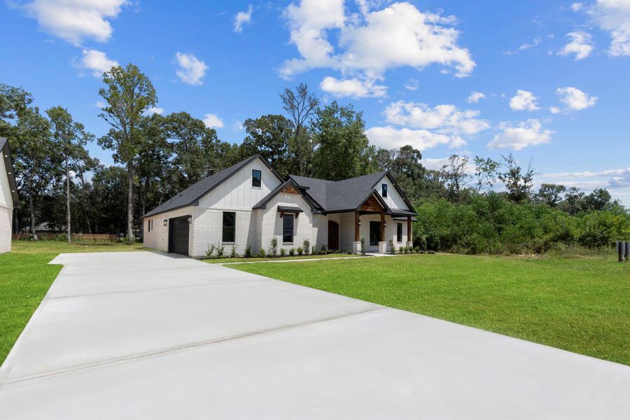 Front exterior of a new home in , Dayton, TX, highlighting curb appeal (Image 25).