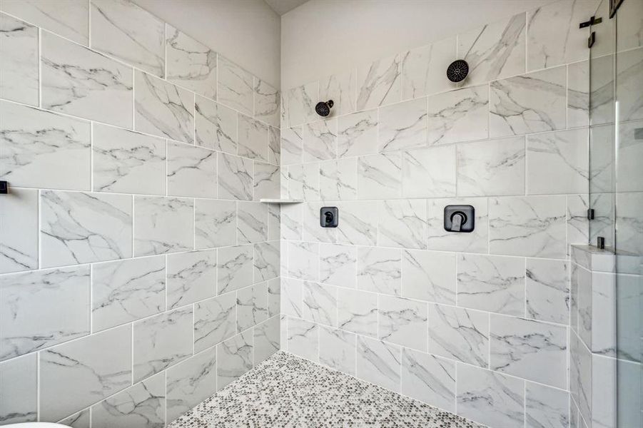 Bathroom featuring a tile shower