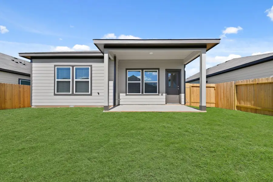 Exterior details and patio area of a home in Lexington Heights, Willis (Image 16). Exterior details and patio area of a home in Lexington Heights, Willis (Image 16).