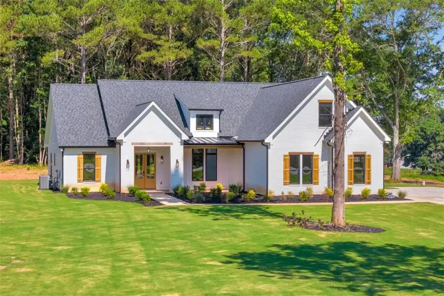 Front exterior of a new home in , Covington, GA, highlighting curb appeal (Image 25). Front exterior of a new home in , Covington, GA, highlighting curb appeal (Image 25).