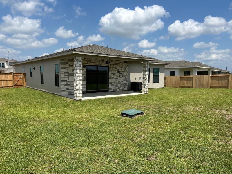 Exterior details and patio area of a home in , Iowa Colony (Image 1).