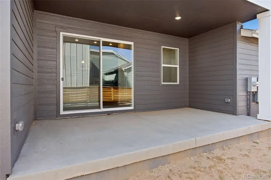 Exterior details and patio area of a home in Trailside on Harmony, Timnath (Image 3).