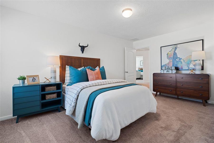 This secondary bedroom features high ceilings, lighting, custom paint, plush carpet, ample closet space, and a large window with privacy blinds!