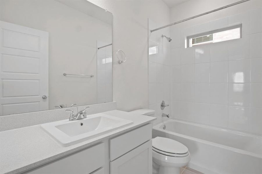 Bathroom in the Pecan II home plan by Trophy Signature Homes – REPRESENTATIVE PHOTO