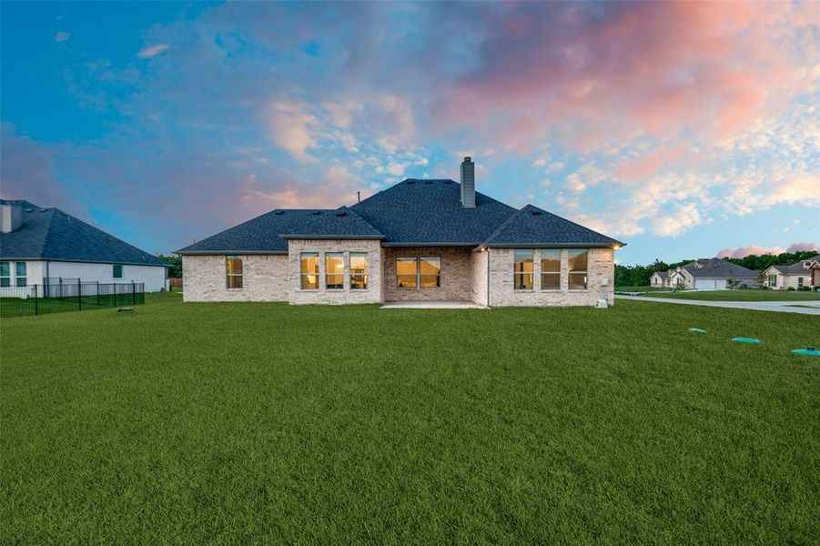 Front exterior of a new home in Lynx Hollow Estates, Forney, TX, highlighting curb appeal (Image 18).