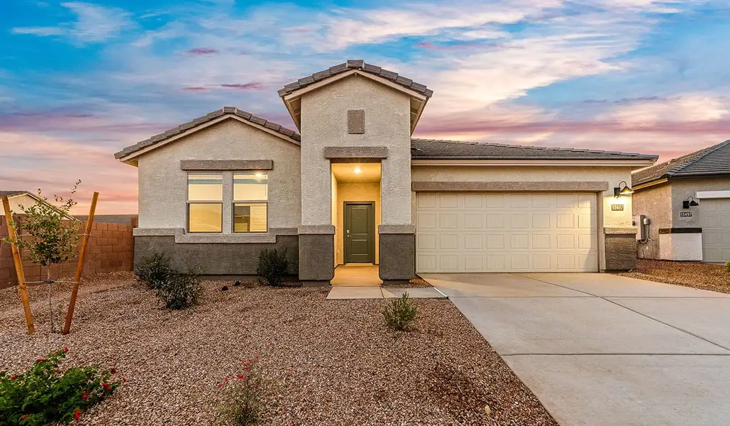 Front exterior of a new home in Hanson Ridge, Vail, AZ, highlighting curb appeal (Image 2). Front exterior of a new home in Hanson Ridge, Vail, AZ, highlighting curb appeal (Image 2).