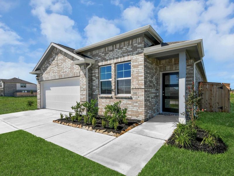 Front exterior of a new home in Emberly, Beasley, TX, highlighting curb appeal (Image 22).