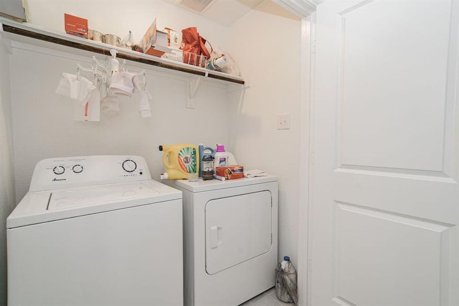 Laundry room featuring independent washer and dryer