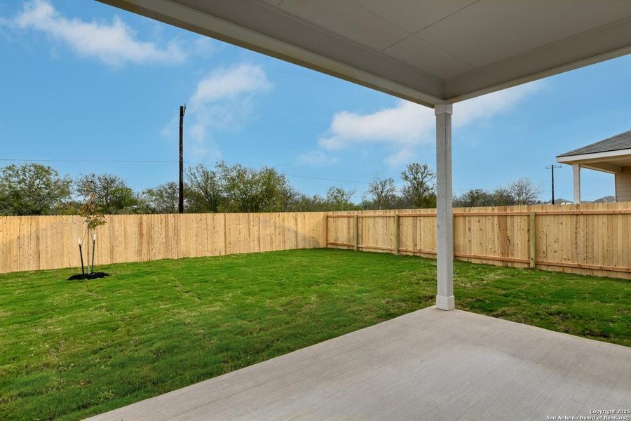 Exterior details and patio area of a home in Meadows at Hennersby Hollow 40's, San Antonio (Image 4).
