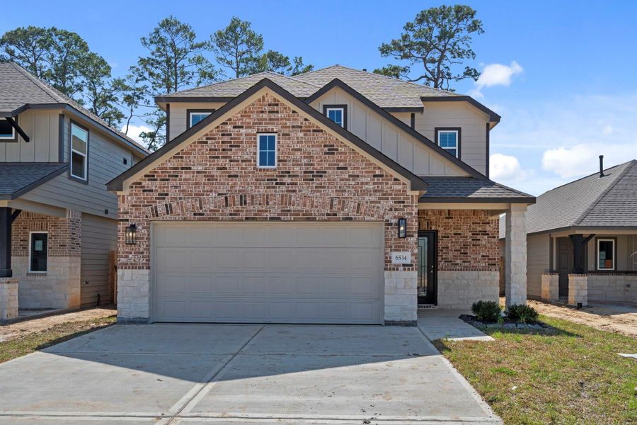 Front exterior of a new home in Cypresswood Landing, Humble, TX, highlighting curb appeal (Image 21).