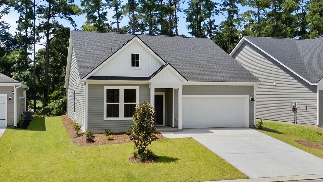 Front exterior of a new home in Bluffs at Sun Colony, Longs, SC, highlighting curb appeal (Image 2).