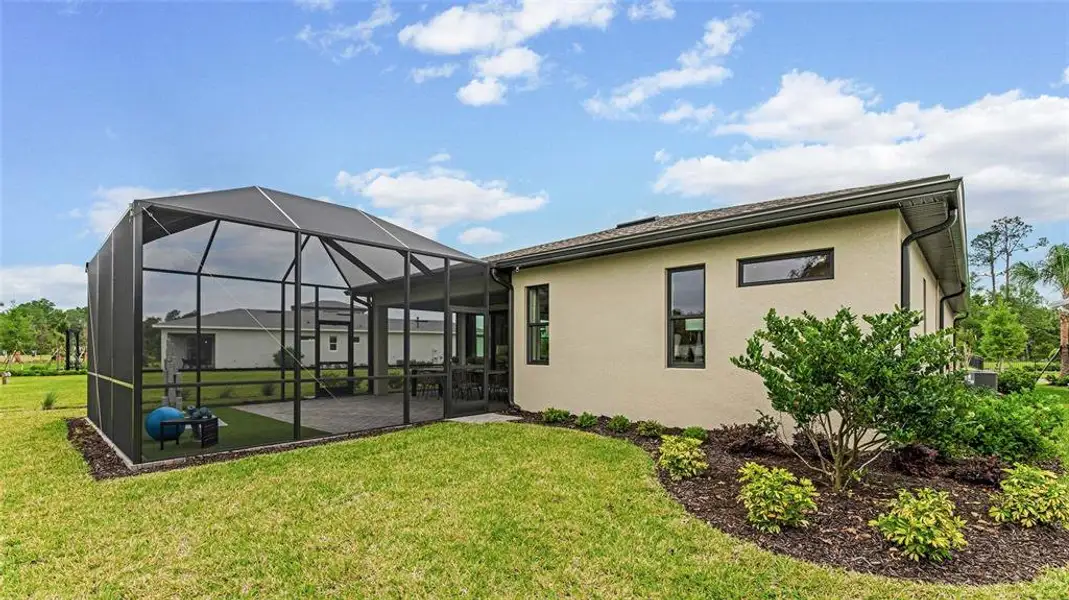 Exterior details and patio area of a home in Cresswind DeLand, Deland (Image 16).