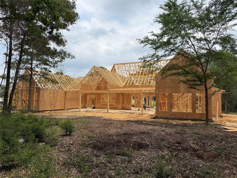 New construction with exposed wooden framing and oriented strand board sheathing