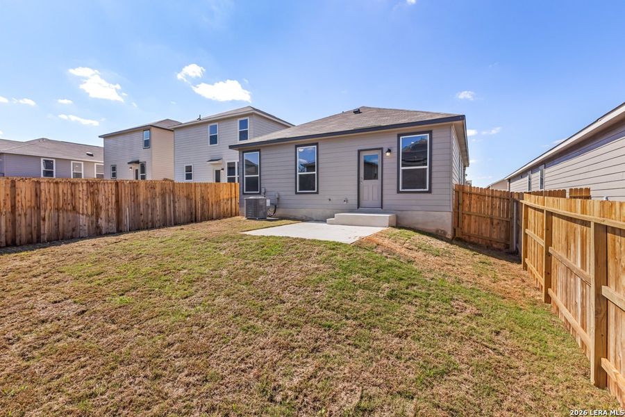 Exterior details and patio area of a home in Knox Ridge, Converse (Image 19).