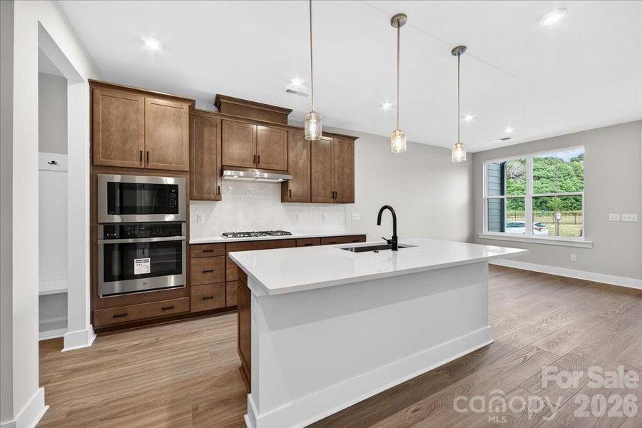 Gourmet kitchen with a large single bowl sink on the island