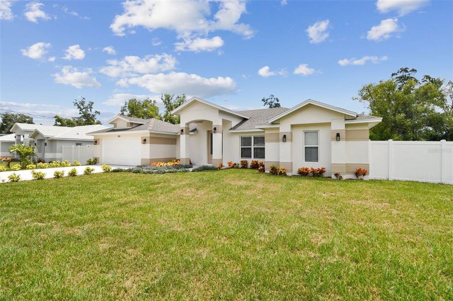 Front exterior of a new home in , Lutz, FL, highlighting curb appeal (Image 23).