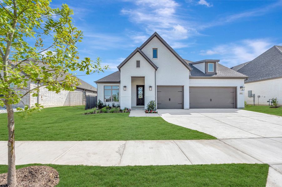 Front exterior of a new home in Goodland – Manor Series, Grand Prairie, TX, highlighting curb appeal (Image 1). Front exterior of a new home in Goodland – Manor Series, Grand Prairie, TX, highlighting curb appeal (Image 1).