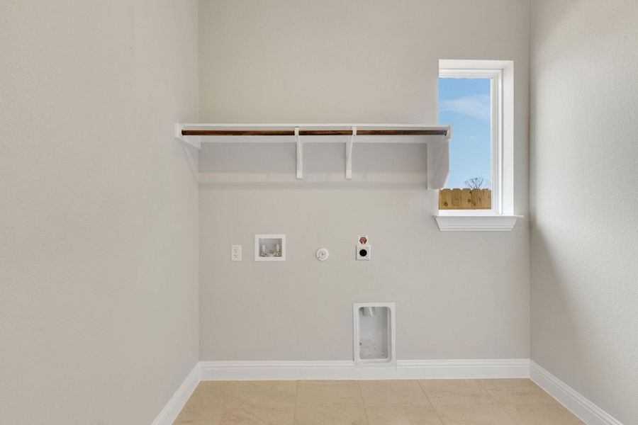 Representative furnished interior of a home built from the Roosevelt by GFO Home in Bluffview Reserve, Leander (Image 29).