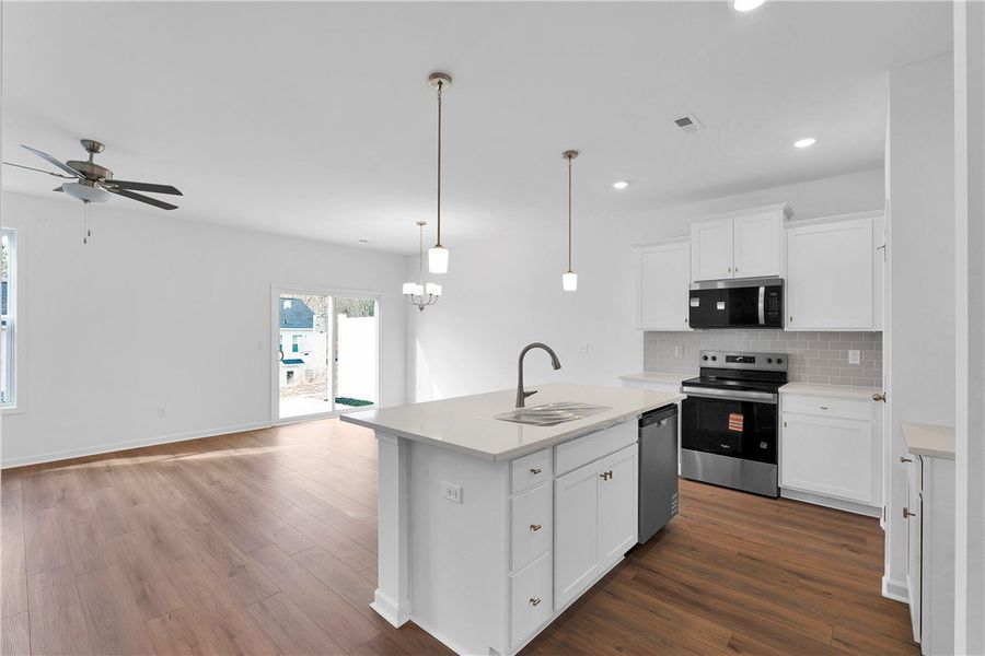 This bright, open-concept kitchen features modern
