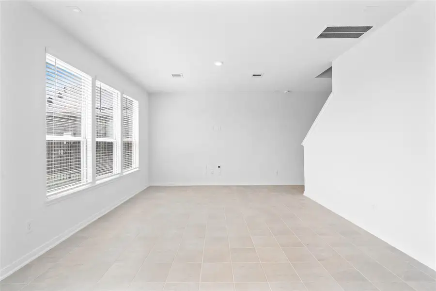 This bright and airy Great Room offers a spacious layout ideal for both relaxing evenings and lively gatherings. Designed for comfort and connection, it features ceramic tile flooring, large windows with blinds, soaring ceilings, recessed lighting, and seamless access to the stunning dining and kitchen—perfect for everyday living and entertaining alike. This bright and airy Great Room offers a spacious layout ideal for both relaxing evenings and lively gatherings. Designed for comfort and connection, it features ceramic tile flooring, large windows with blinds, soaring ceilings, recessed lighting, and seamless access to the stunning dining and kitchen—perfect for everyday living and entertaining alike.