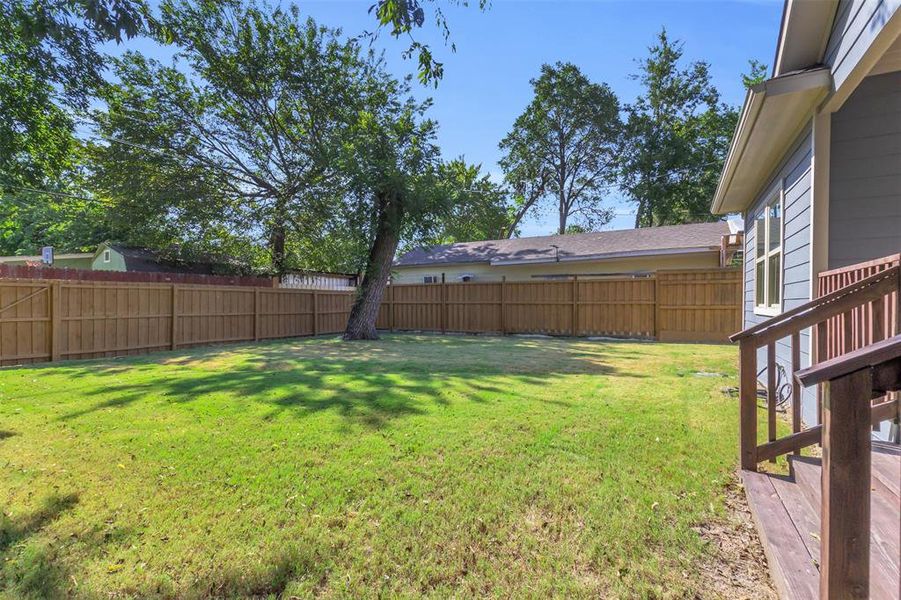 View of fenced backyard