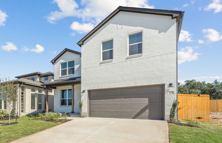 Front exterior of a new home in Woodside, Georgetown, TX, highlighting curb appeal (Image 23).