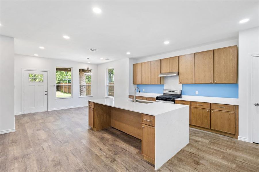 Beautiful Brown Cabinetry in Kitchen and Quartz White Island Beautiful Brown Cabinetry in Kitchen and Quartz White Island