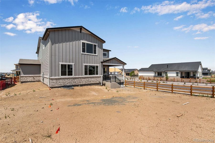 Front exterior of a new home in Ensemble at The Aurora Highlands, Aurora, CO, highlighting curb appeal (Image 24).