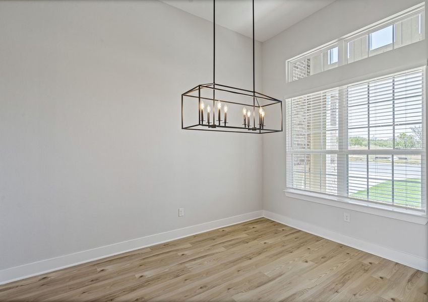 The dining room has large windows that let in great, natural light.