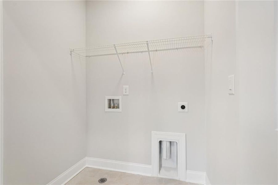 Laundry room with hookup for a washing machine and electric dryer hookup