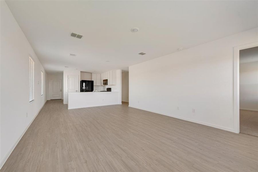 Unfurnished living room featuring light hardwood / wood-style flooring