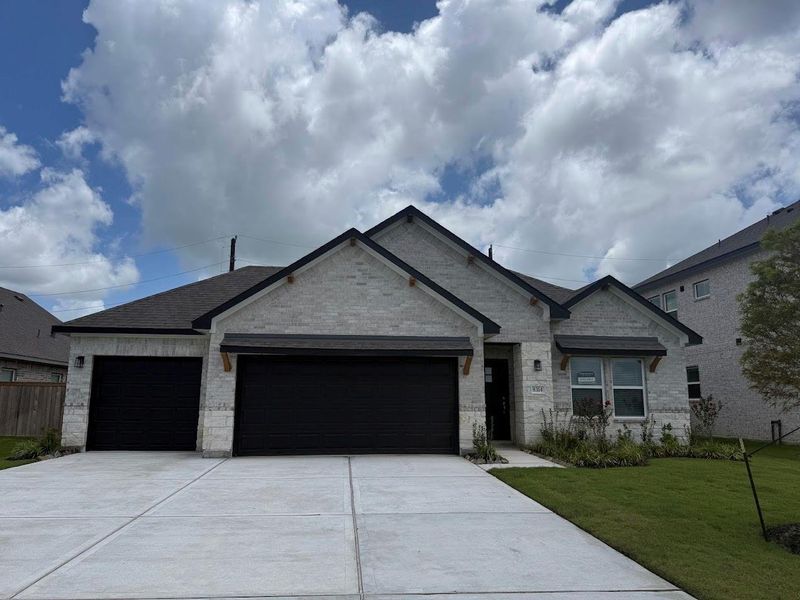 Front exterior of a new home in Ashland, Angleton, TX, highlighting curb appeal (Image 1). Front exterior of a new home in Ashland, Angleton, TX, highlighting curb appeal (Image 1).