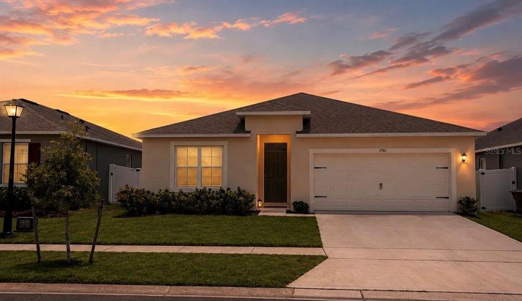 Front exterior of a new home in , Kissimmee, FL, highlighting curb appeal (Image 1). Front exterior of a new home in , Kissimmee, FL, highlighting curb appeal (Image 1).