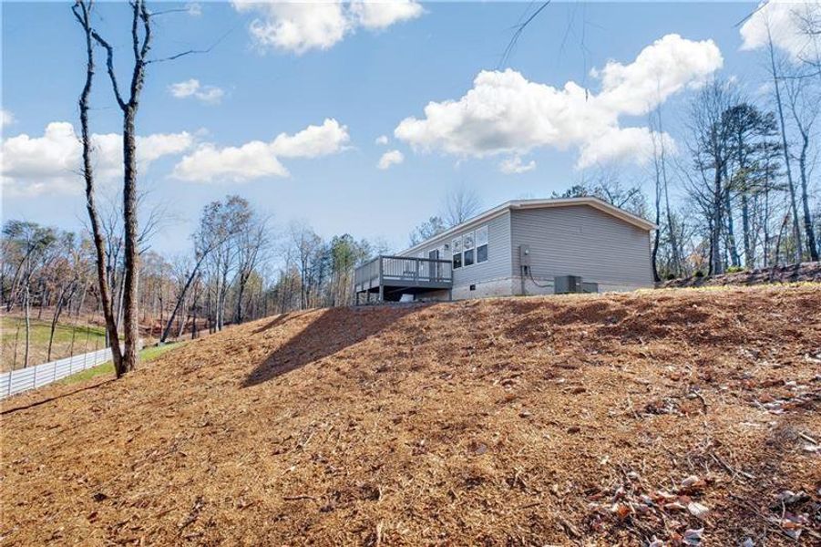 Front exterior of a new home in , Ball Ground, GA, highlighting curb appeal (Image 17).