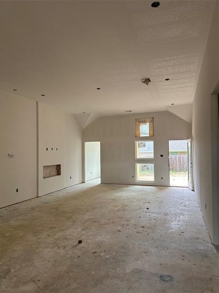 living room with 50" led fireplace, 11' ceilings