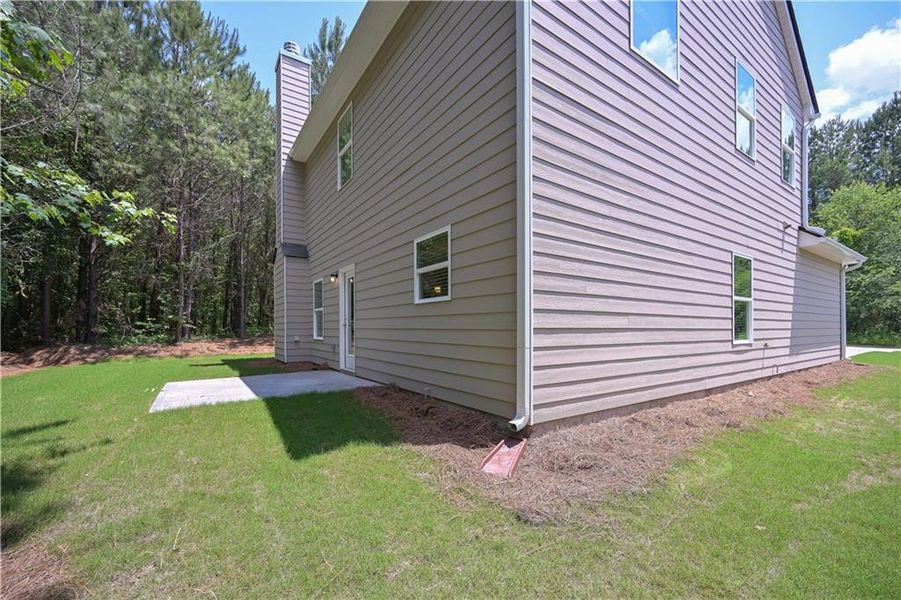 Front exterior of a new home in , Villa Rica, GA, highlighting curb appeal (Image 9).