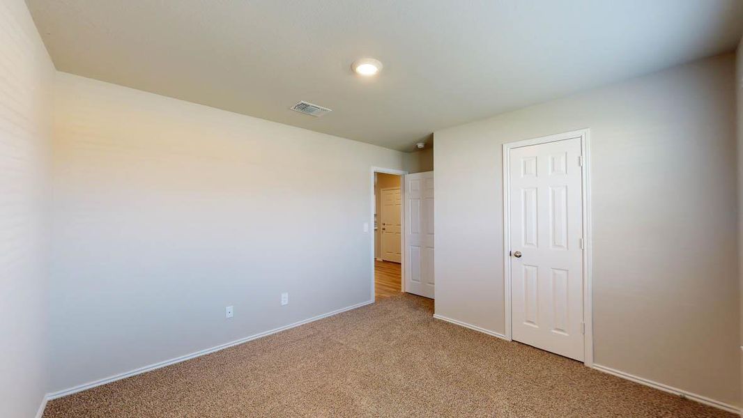 Unfurnished bedroom featuring carpet floors and a closet