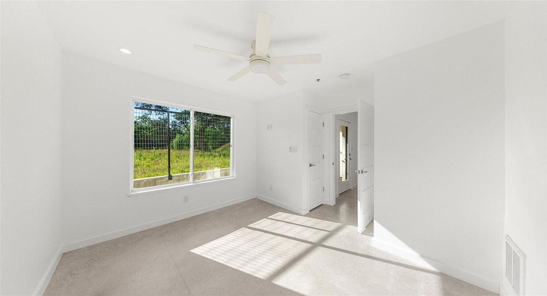 A serene bedroom bathed in natural light, designed as a restful retreat at the end of the day. Model No. 104 Shown.