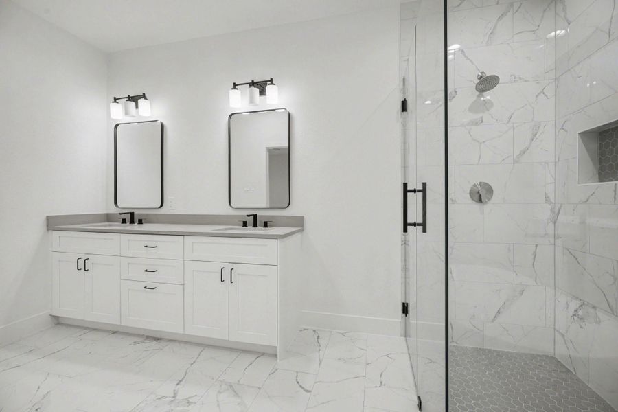 Dual sinks in the primary bathroom.