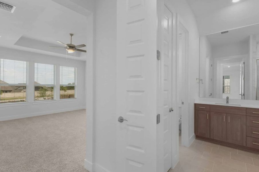 Representative furnished interior of a home built from the Mariah by Chesmar Homes in University Heights, McKinney (Image 11).