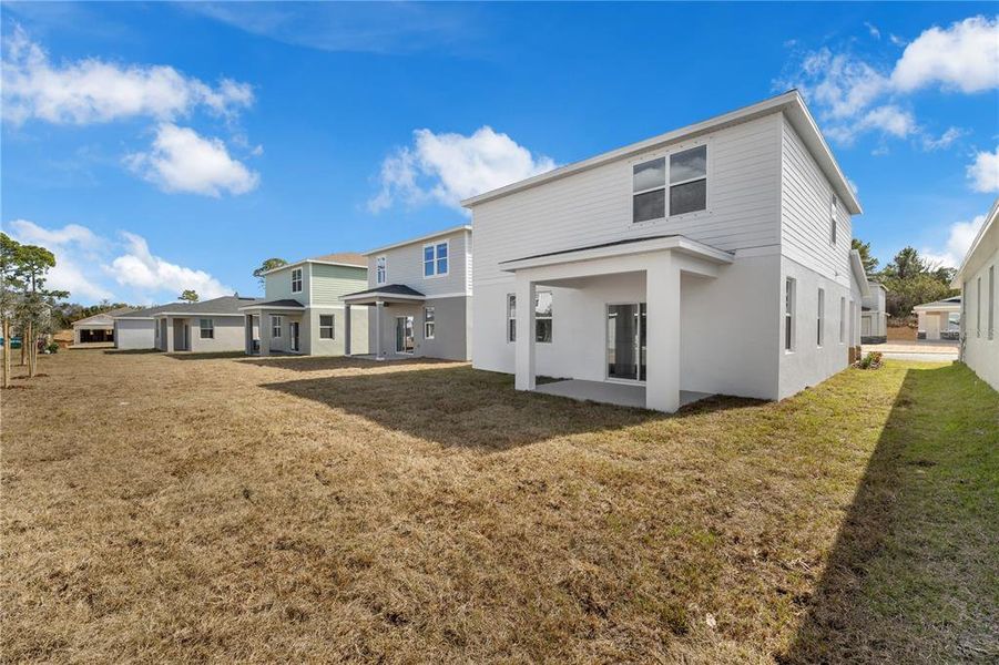 Exterior details and patio area of a home in Watermark, Cocoa (Image 25).